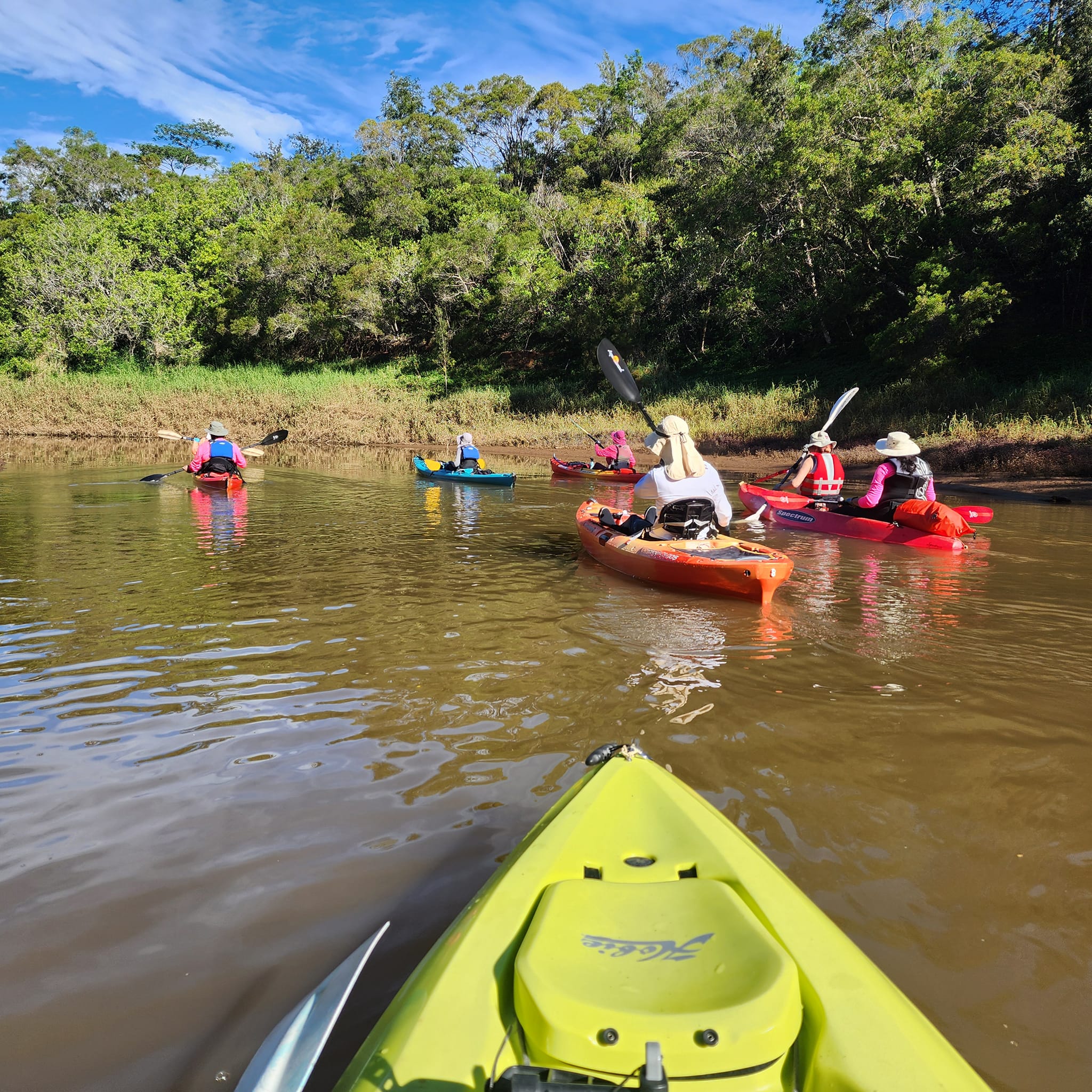 Kayak bow points to a group paddling on Lake Wilson