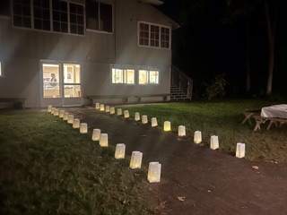 Luminaries light the path to the clubhouse doors