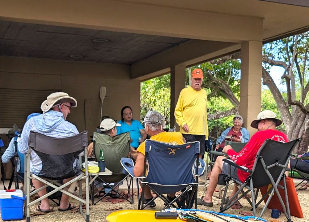 Auctioneer Chuck starts the used gear auction