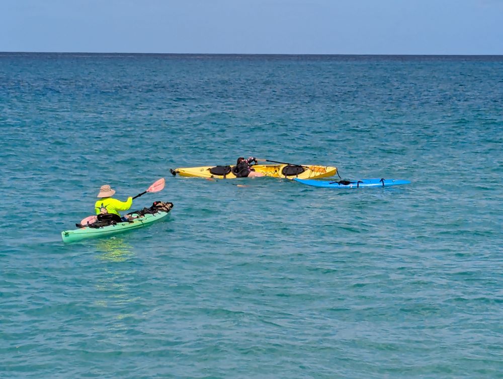 Carolyn getting back on her kayak