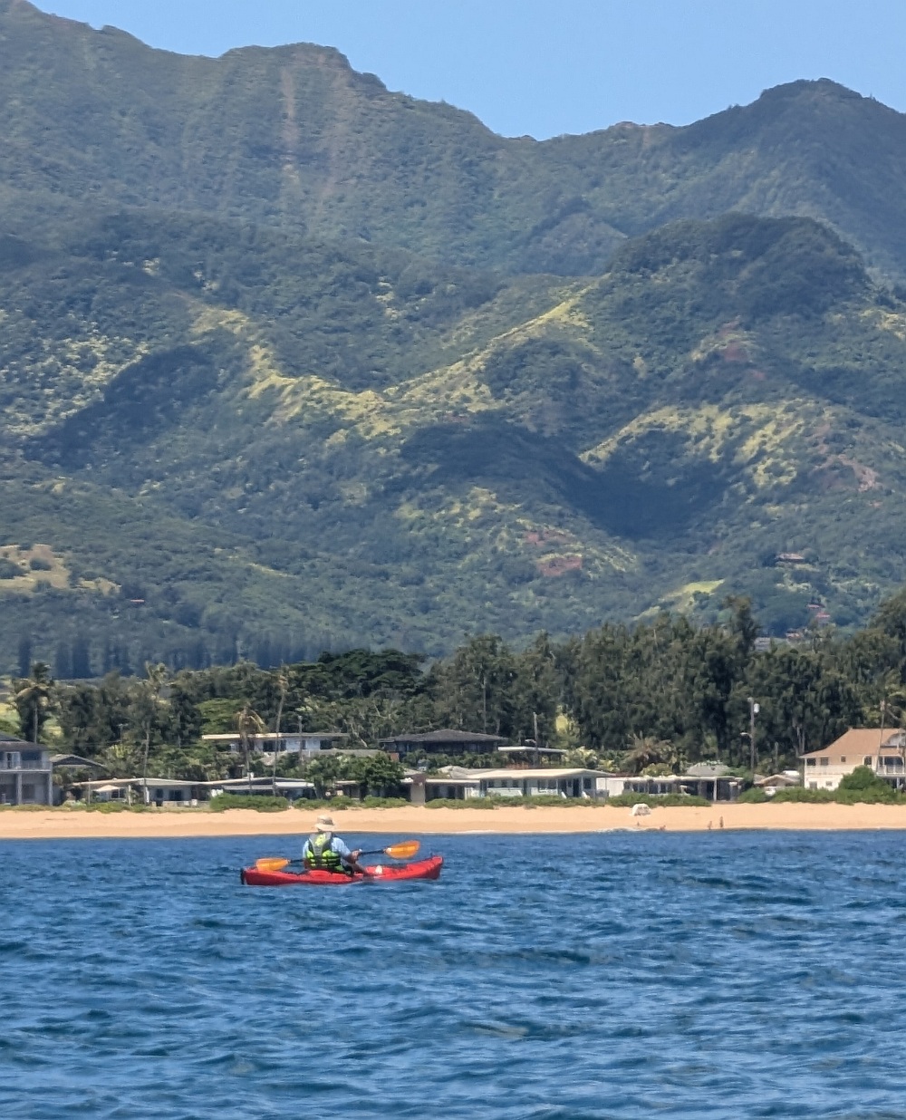 Kayaker going past Haleiwa