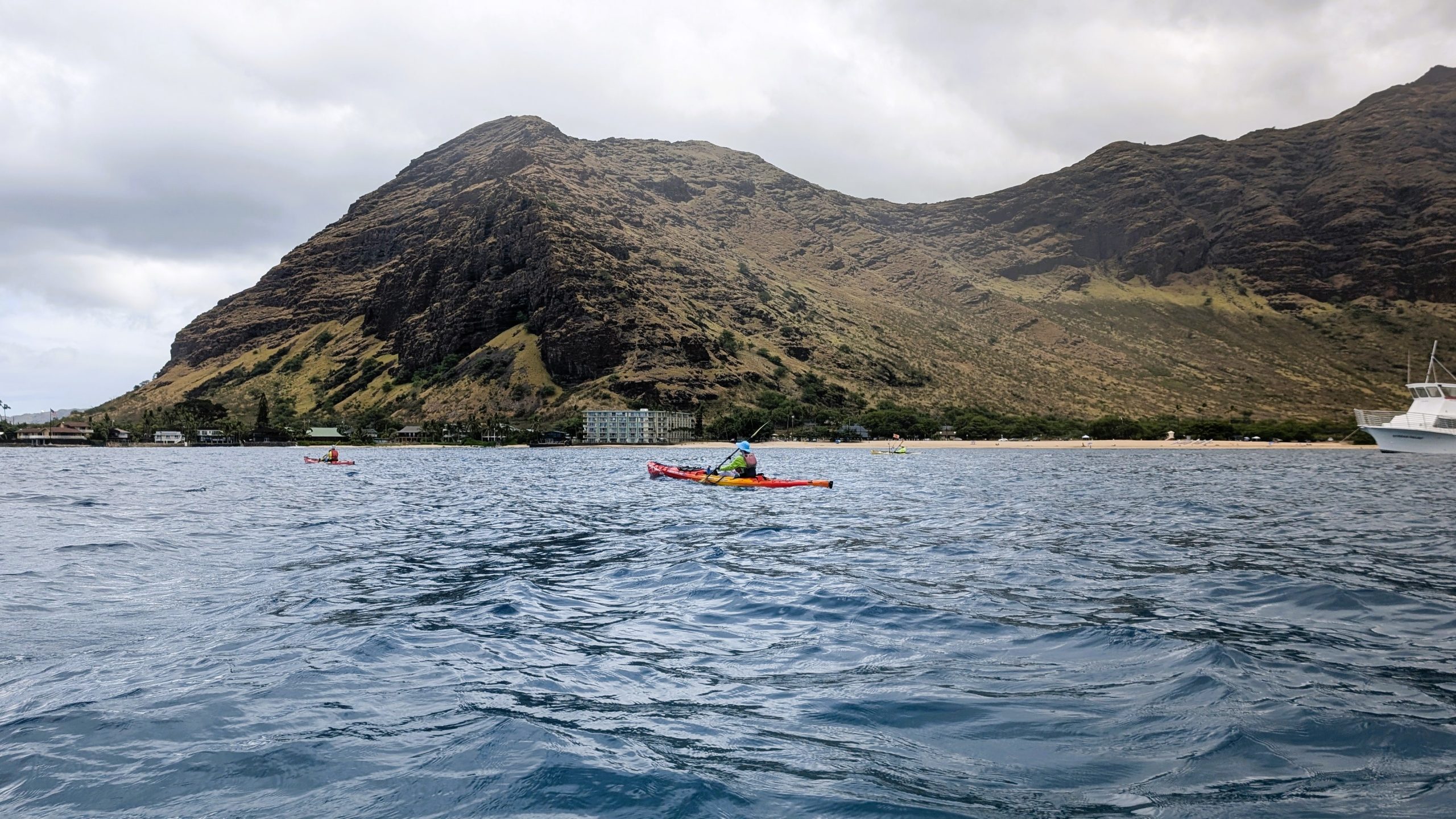 Three kayakers at Makaha Bay