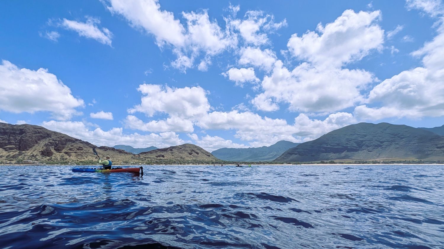 Kayaker with Nanakuli Valley in background